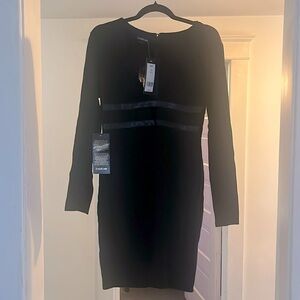 Large Black Bebe knee length bodycon dress. NWT never worn.
